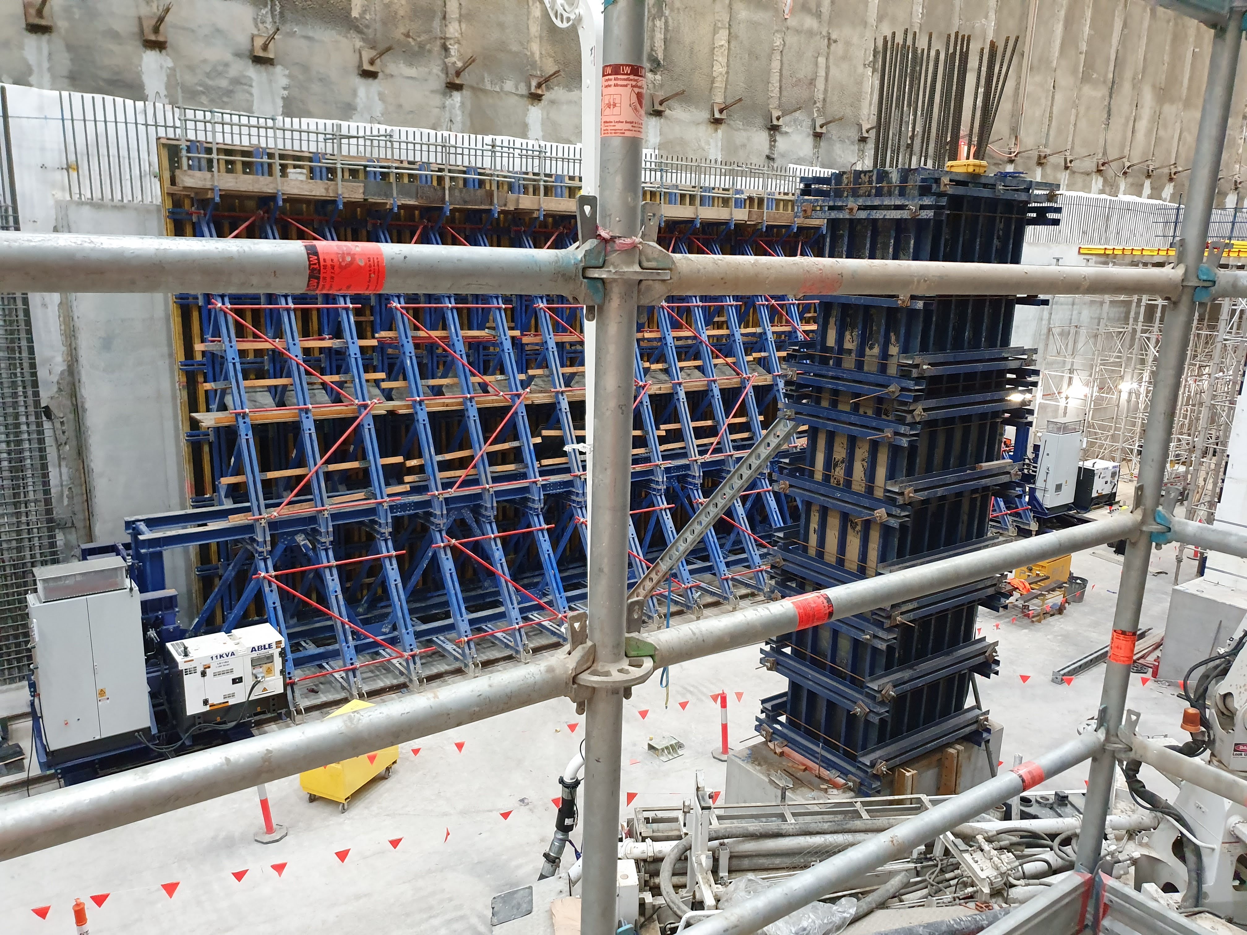 Site view of the formwork system across a long concrete wall section