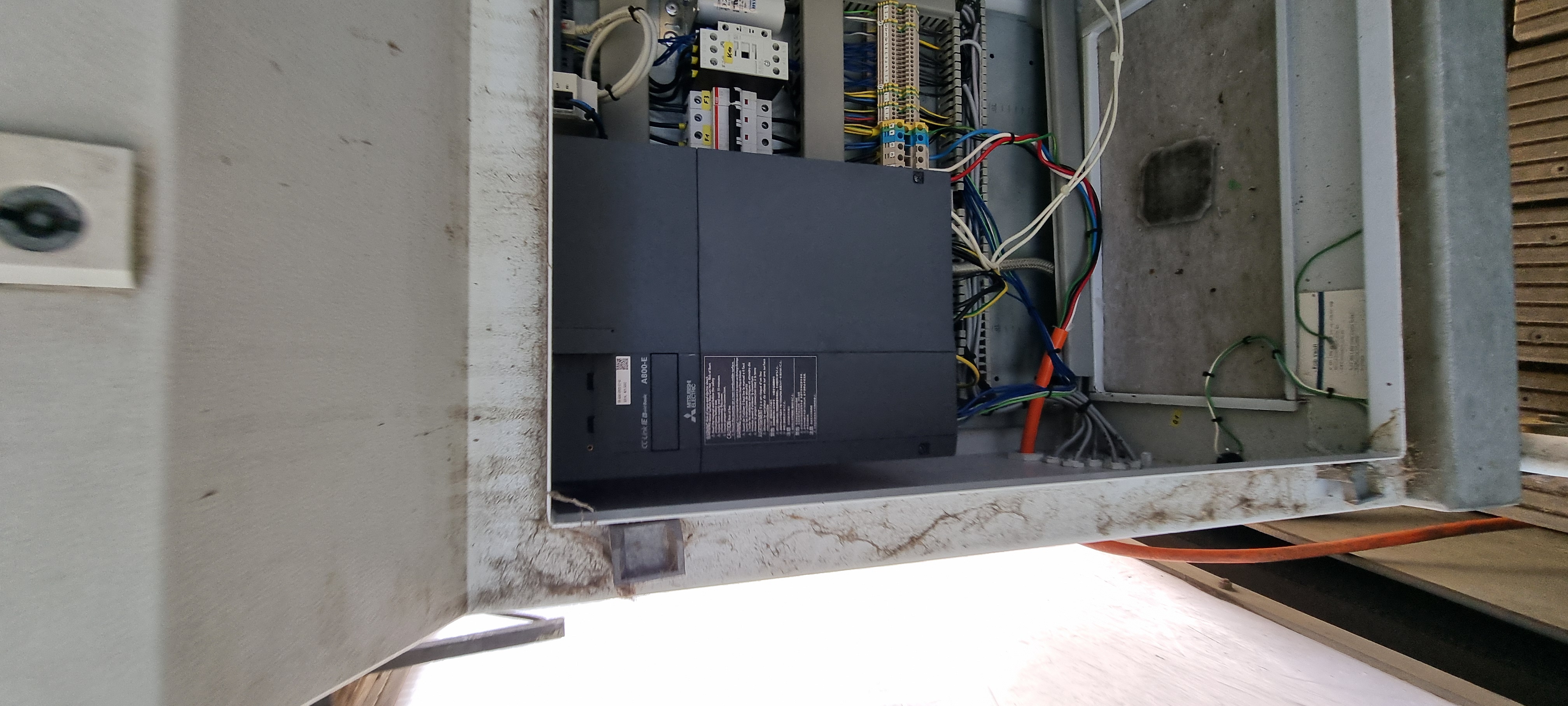 Existing Mitsubishi A800-E VSD mounted in the treadmill control cabinet with motor protection and contactors